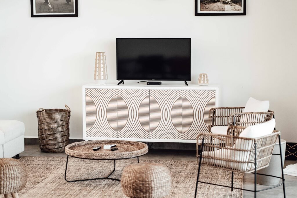 Living room with rattan chairs and woven basket.