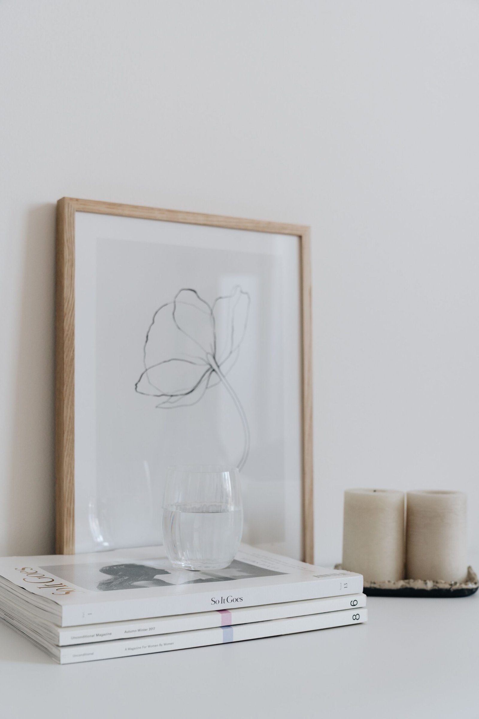 A picture with a natural oak frame.